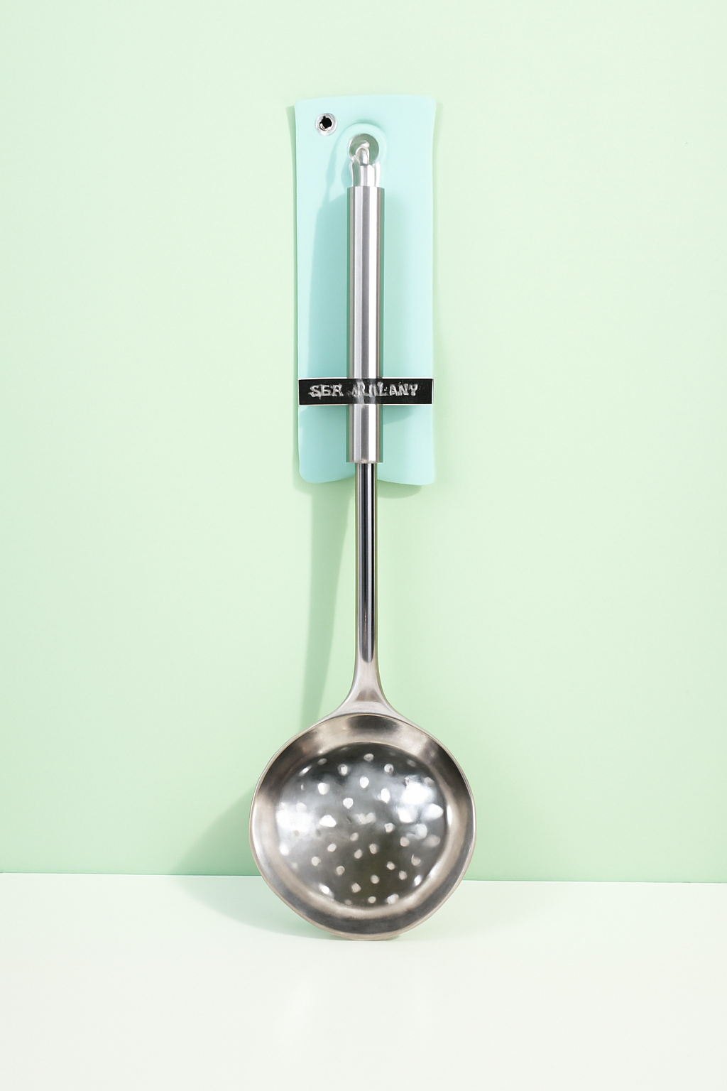 Slotted spoon with magnetic steel handle